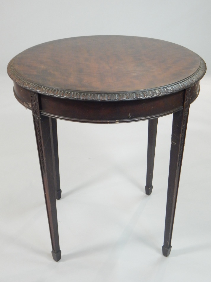 Appraisal: An Edwardian mahogany occasional table the circular top with a