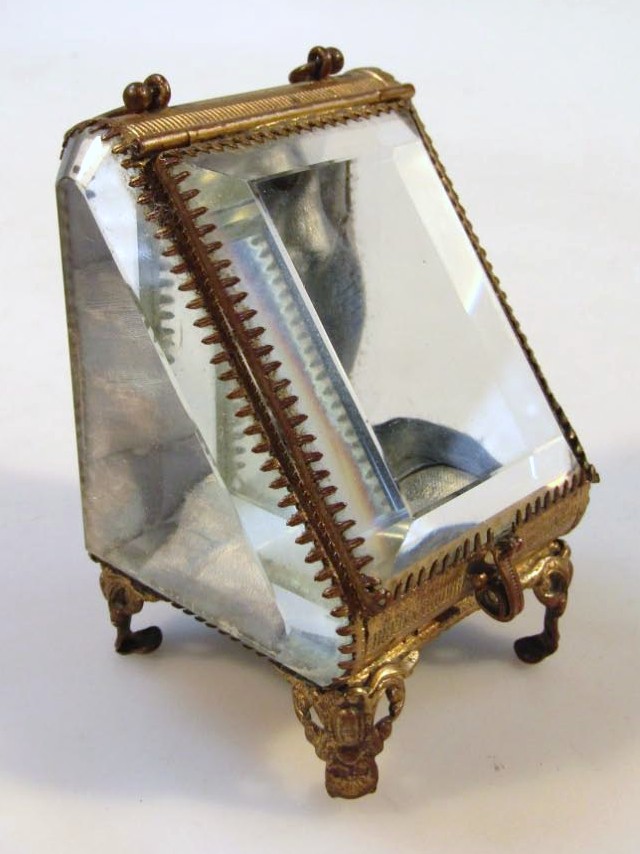 Appraisal: A glass pocket watch casket with a swing lid above