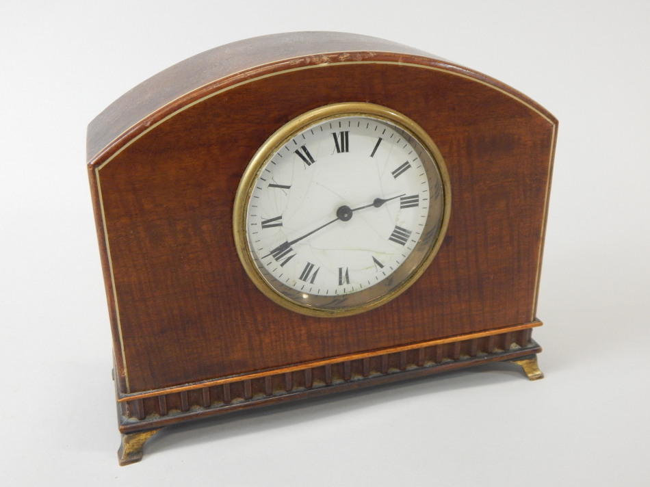 Appraisal: An Edwardian mahogany mantel clock with a white enamel dial