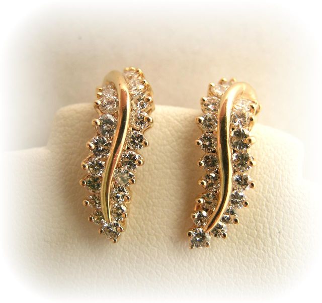 Appraisal: k yellow gold diamond non-pierced earrings in leaf drop motif