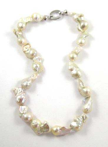 Appraisal: MATINEE LENGTH BAROQUE PEARL NECKLACE strung with baroque white pearls