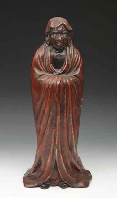 Appraisal: A JAPANESE FIGURE of a standing Daruma in red painted