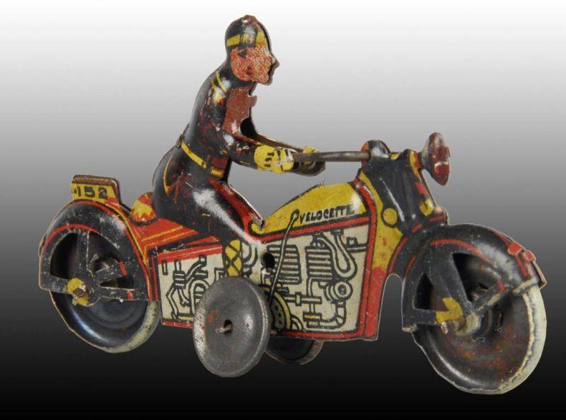 Appraisal: Tin Spanish Motorcycle Penny Toy Description Push toy Marked Velocette