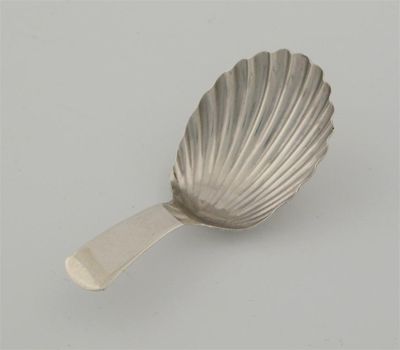 Appraisal: A George III caddy spoon with a fluted bowl by