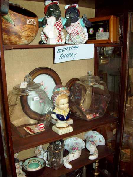 Appraisal: FOUR SHELVES OF SUNDRIES CONSISTING OF CHINA SPOON BRASS WARE