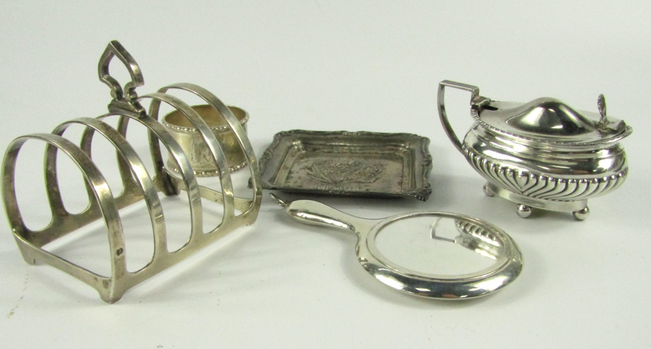 Appraisal: A miniature silver hand mirror Birmingham silver napkin ring oval