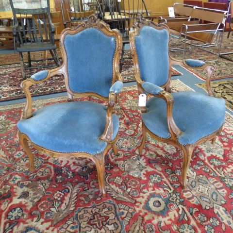 Appraisal: Pair of Carved French Arm Chairs rococo style blue velvet