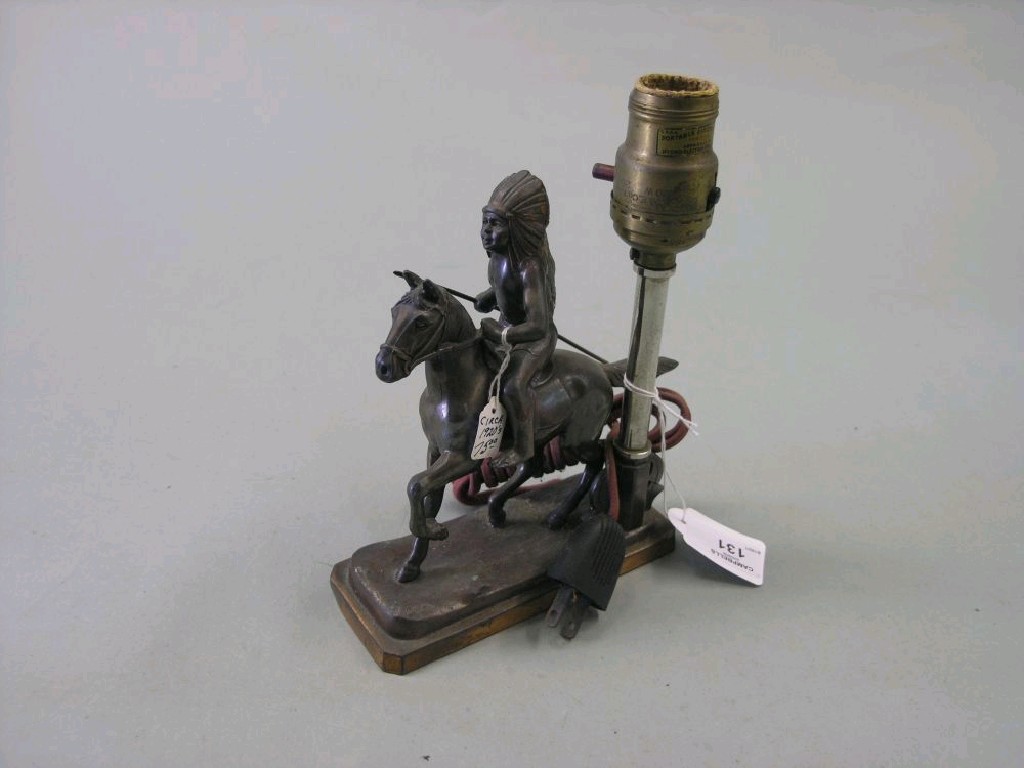 Appraisal: An unusual spelter table lamp in the form of a