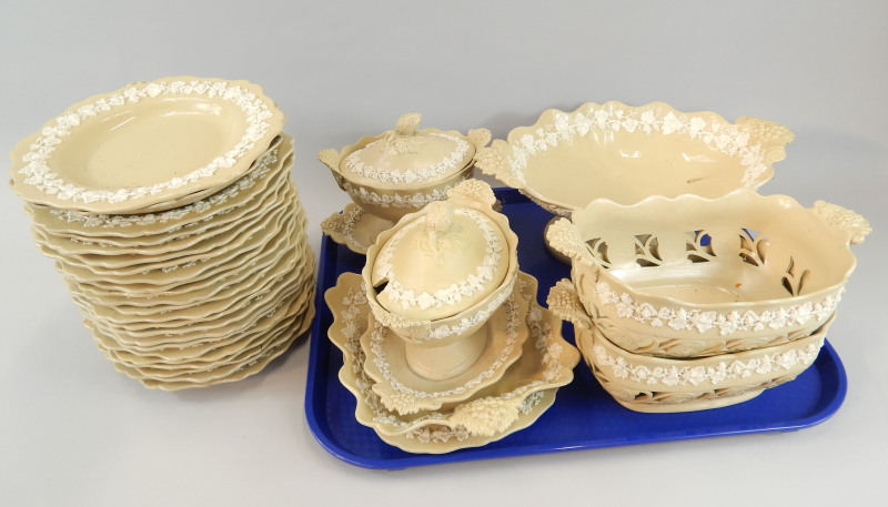 Appraisal: An extensive thC drab or cane ware part dessert service