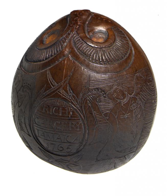 Appraisal: JAMAICA A CARVED COCONUT FLASK DATED with ram's horn's and