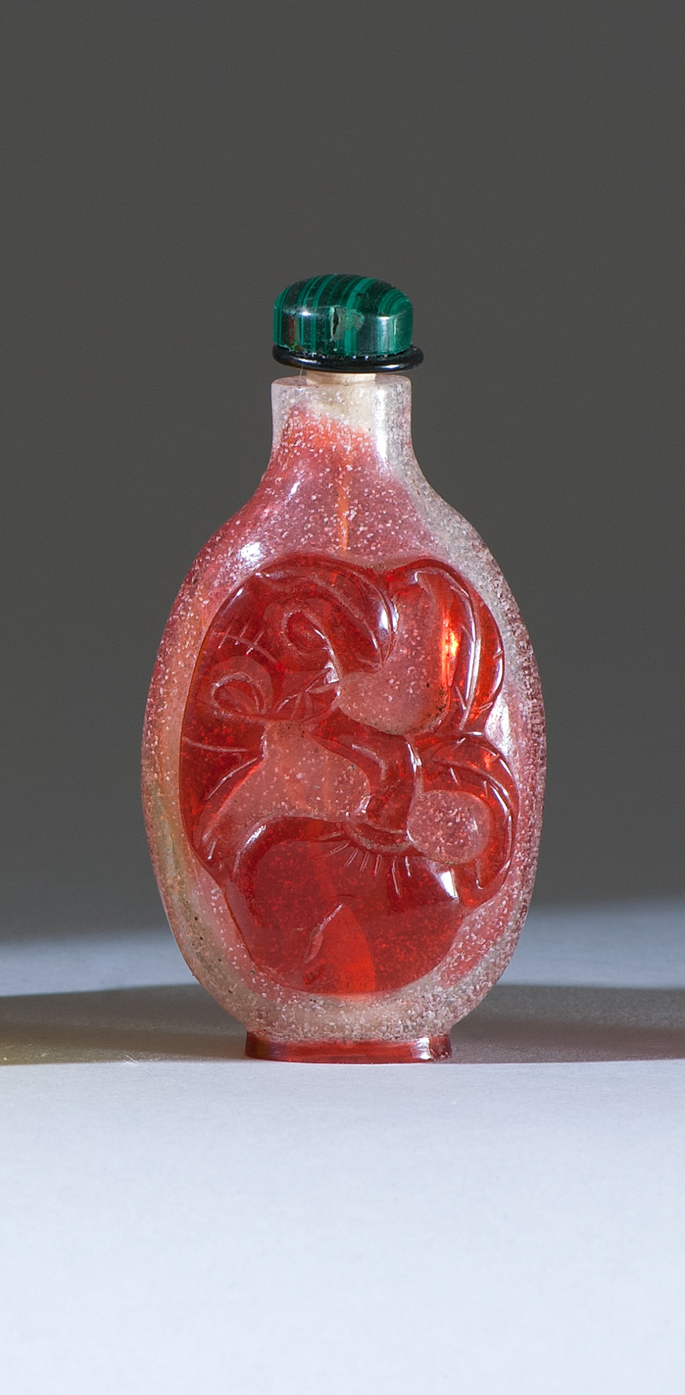 Appraisal: OVERLAY GLASS SNUFF BOTTLE th CenturyIn spade shape with red