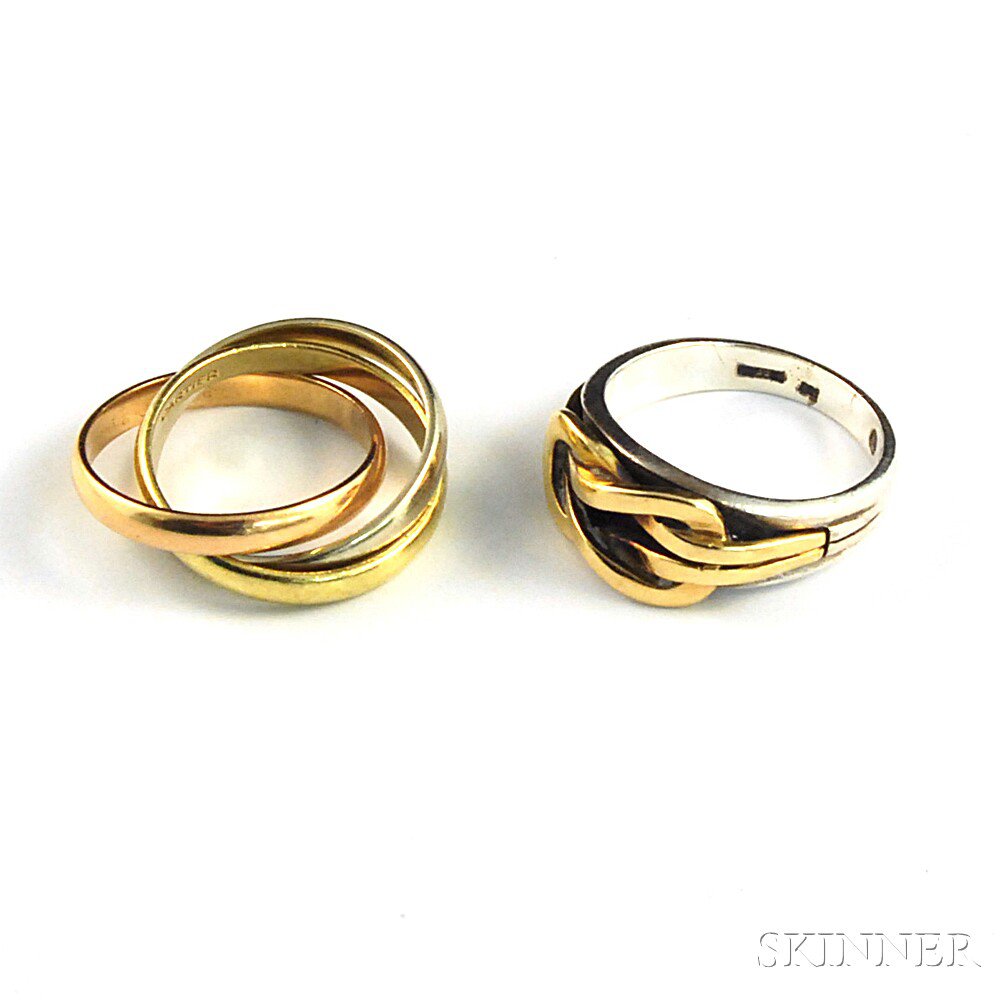 Appraisal: Two Designer Rings a Cartier tricolor kt gold rolling ring