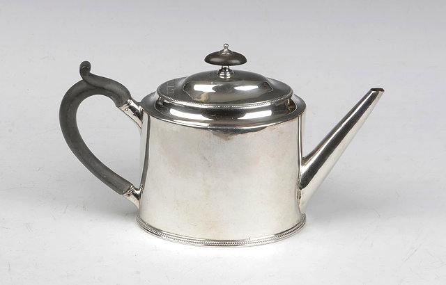 Appraisal: A GEORGE III PLAIN OVAL TEAPOT with beaded rim domed