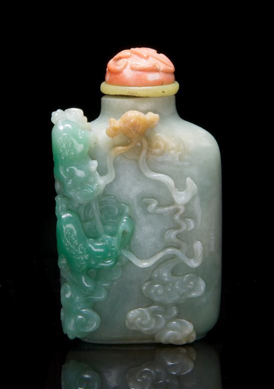 Appraisal: Chinese Jade Snuff Bottle the bottle with apple green inclusions