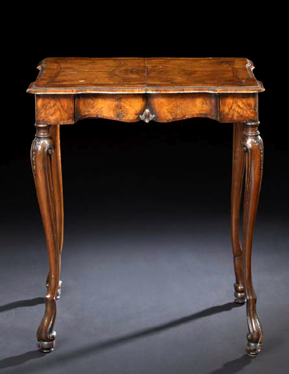 Appraisal: Italian Carved Walnut Table the banded and shaped rectangular top