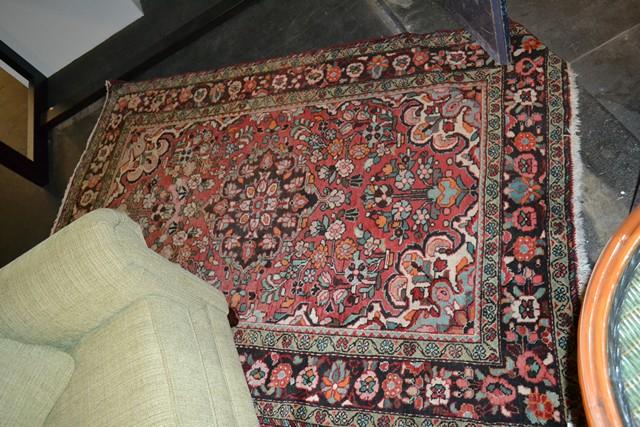 Appraisal: A FRENCH CARPET IN BURGUNDY ORANGE AND GREEN A FRENCH