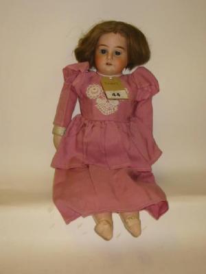 Appraisal: An Armand Marseille bisque shoulder head doll with blue sleeping