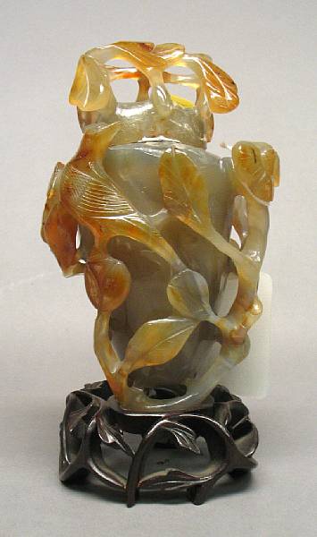 Appraisal: A carved agate covered vase The ovoid vase and cover