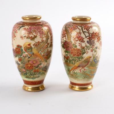 Appraisal: A pair of Japanese Satsuma bottle vases painted in polychrome