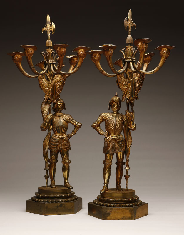 Appraisal: A pair of Louis Philippe gilt-bronze figural candelabra medieval knights