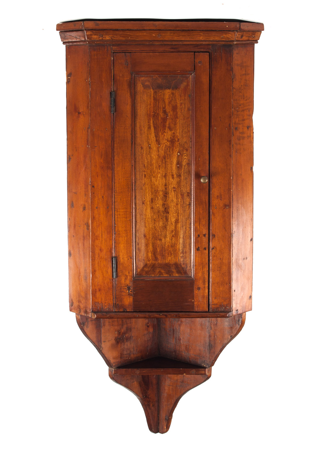 Appraisal: American vernacular pine hanging corner cupboard th century paneled door