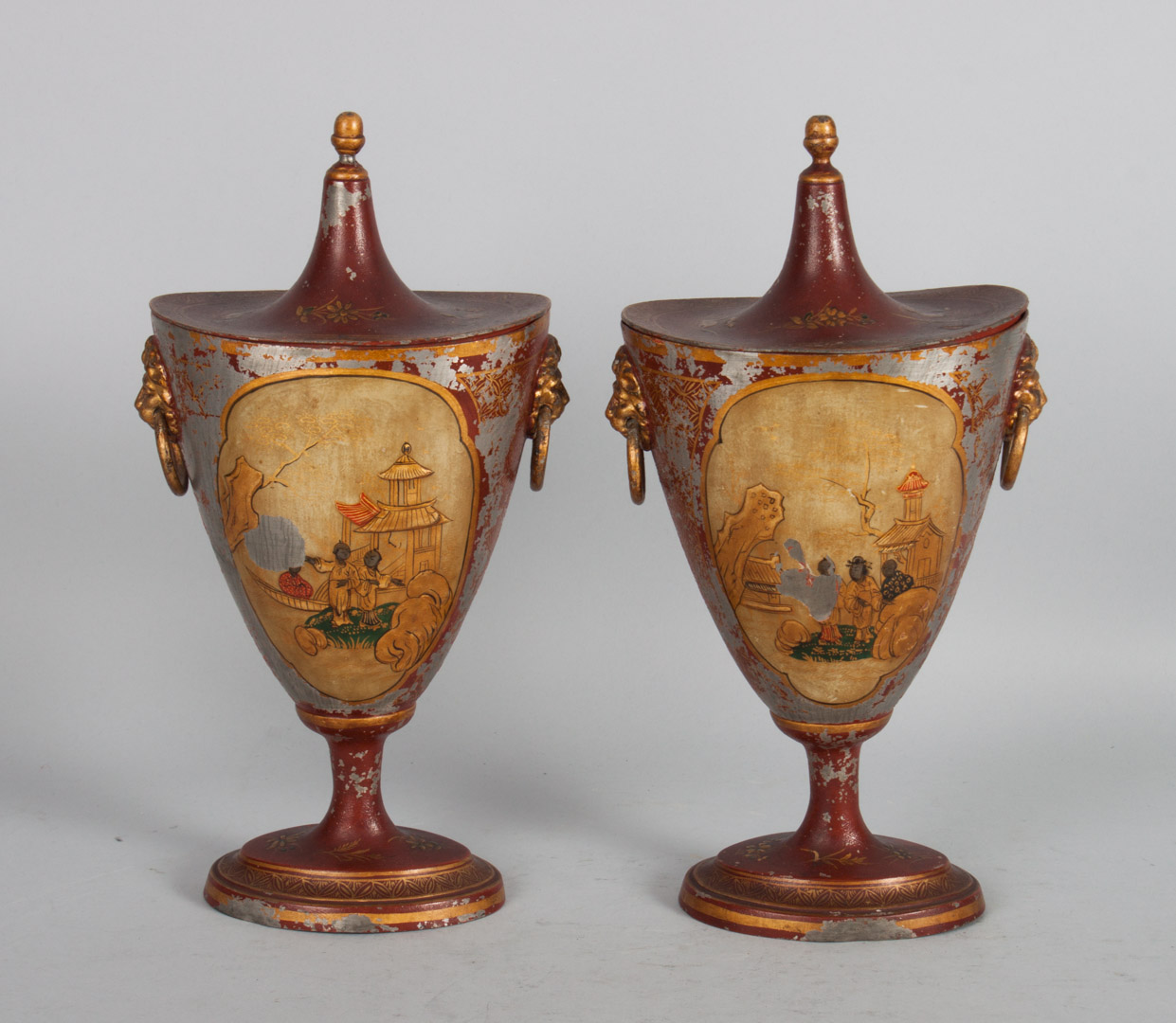 Appraisal: Pair of George III painted pewter chestnut urns with red