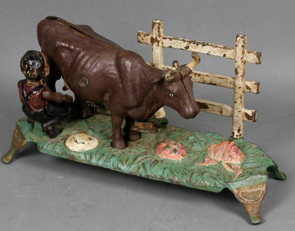 Appraisal: Late th Century cast iron mechanical bank Kicking Cow h