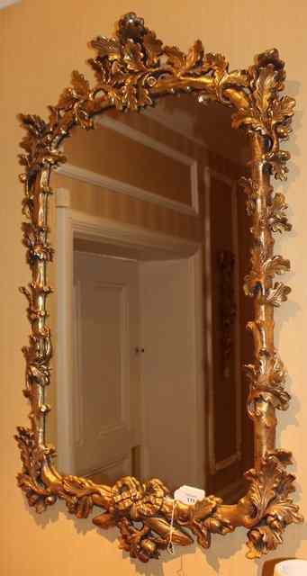 Appraisal: A GEORGIAN STYLE GILT MIRROR the frame in the form