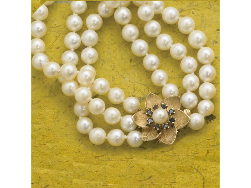 Appraisal: TRIPLE STRAND PEARL BRACELET Containing seven mm pearls and k