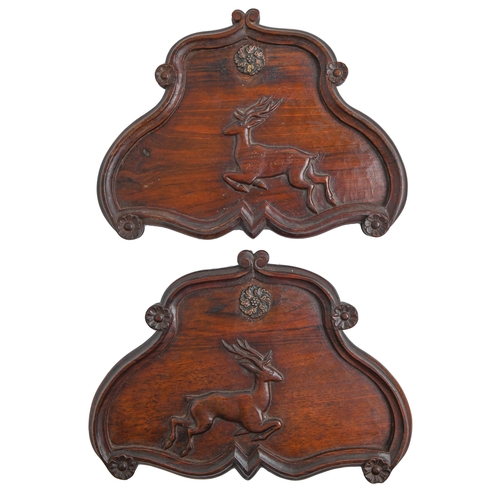 Appraisal: A pair of Victorian carved walnut cartouches with leaping deer