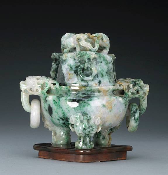 Appraisal: A mottled jadeite tripod censer and cover th Century The