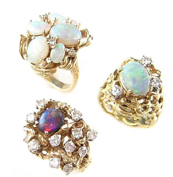 Appraisal: A collection of three diamond opal and gold free form