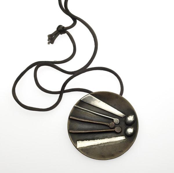 Appraisal: ED WIENER Brass pendant with applied copper and silver design