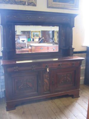 Appraisal: A VICTORIAN MAHOGANY SIDEBOARD the raised mirrored back with moulded