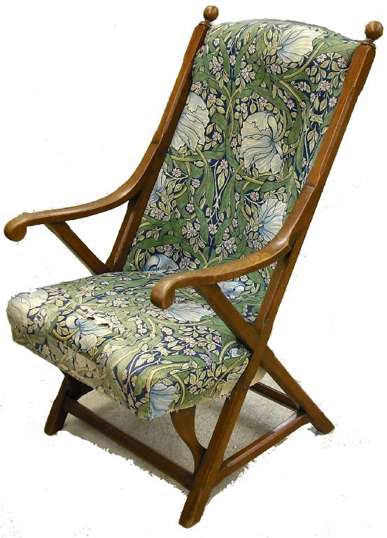 Appraisal: Arts Crafts style upholstered armchair the padded back and seat