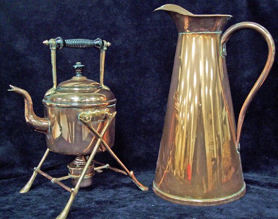 Appraisal: A tall copper jug and a copper kettle on stand