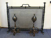 Appraisal: A pair of heavy wrought iron Arts Crafts firedogs and