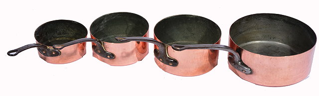 Appraisal: FOUR TH CENTURY COPPER SAUCEPANS of graduated size with iron