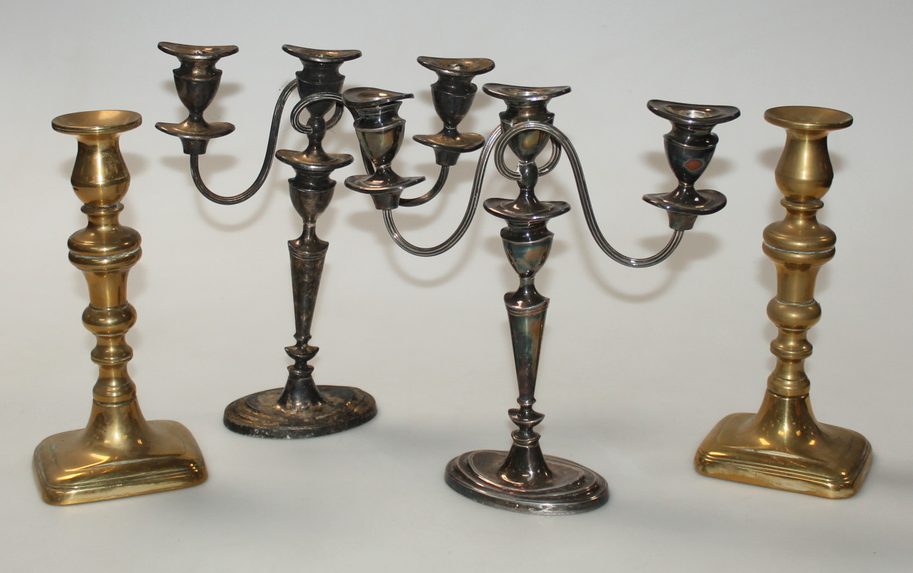 Appraisal: A pair of late thC brass candlesticks each with cylindrical