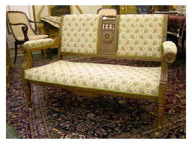 Appraisal: Eastlake walnut Victorian loveseat with upholstered cushion and back