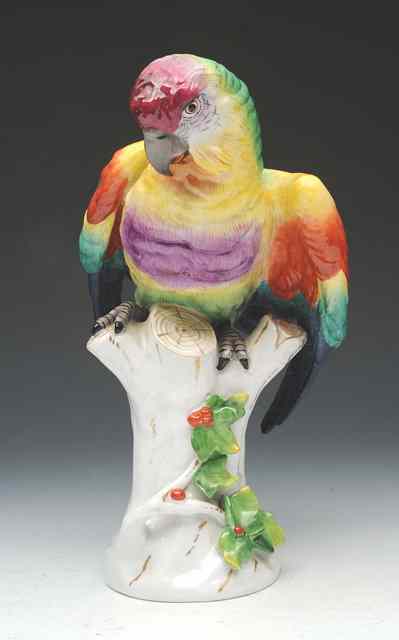 Appraisal: AN EARLY TH CENTURY CONTINENTAL PORCELAIN PARROT perched on a