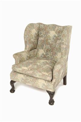 Appraisal: A mahogany wing armchair in George III style on leaf