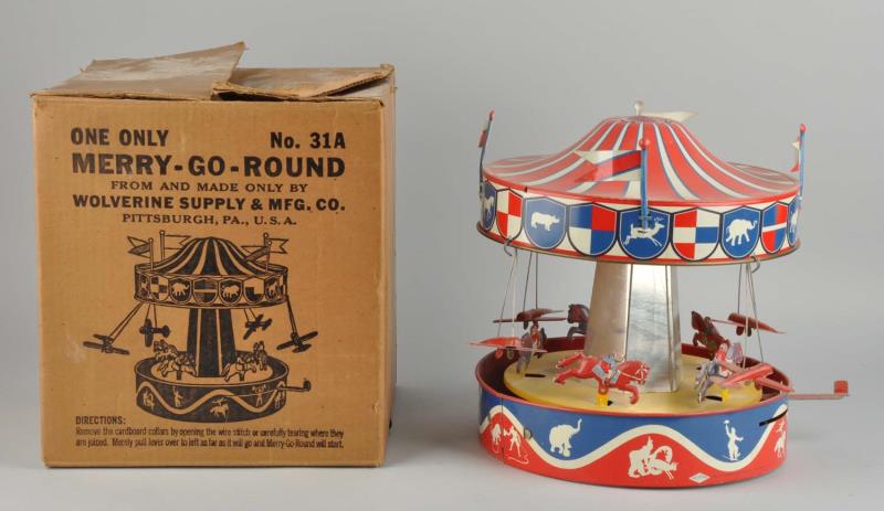 Appraisal: Tin Friction Merry-Go-Round In original box The toy itself has