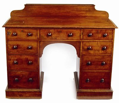 Appraisal: A Victorian fiddle back mahogany kneehole desk with a later