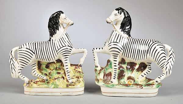 Appraisal: A Pair of English Staffordshire Pottery Zebras th c with