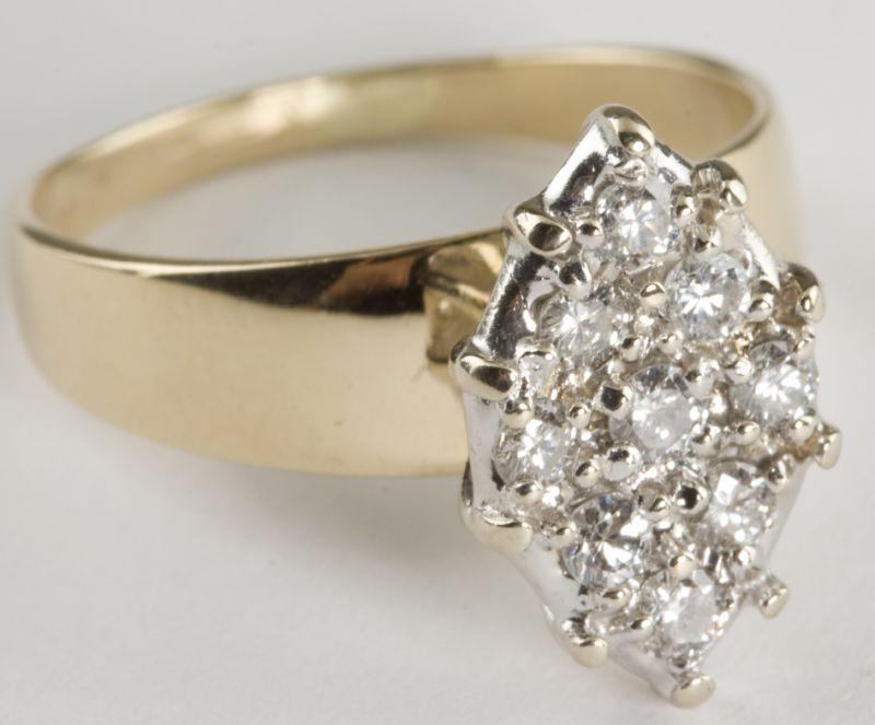 Appraisal: KT Marquise Shaped Diamond Cluster Ring set with round brilliant