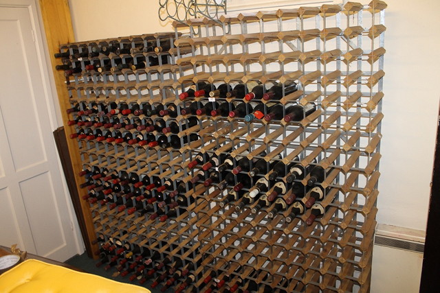 Appraisal: TWO WINE RACKS both capable of holding bottles