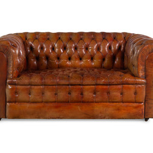 Appraisal: An English Leather Upholstered Chesterfield Sofa Early th Century Height