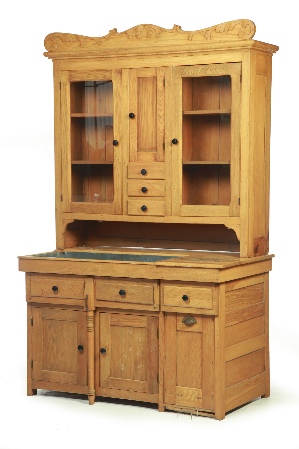 Appraisal: TWO-PIECE BAKERS' CABINET American c Oak with pine secondary Scrolled