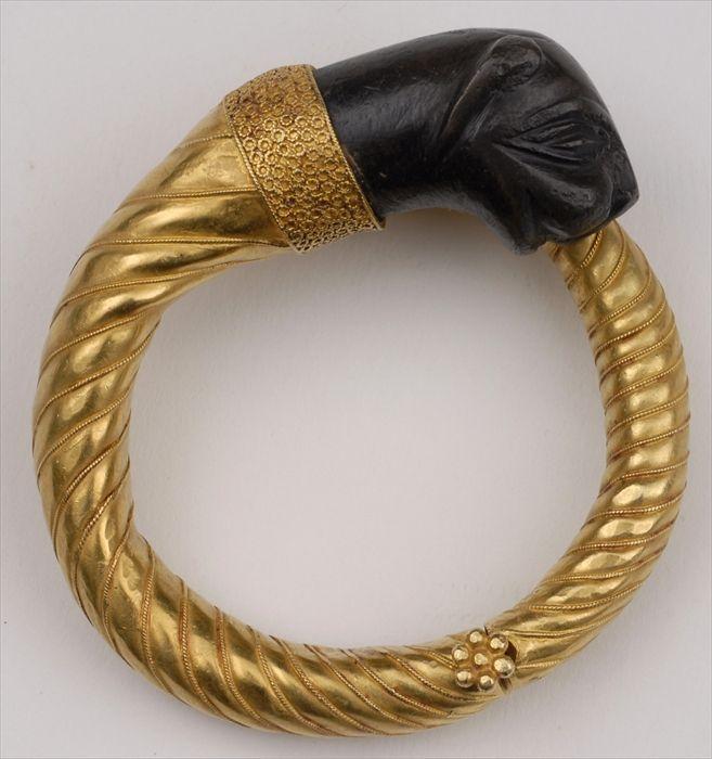 Appraisal: GOLD BRACELET WITH STONE LION HEAD TERMINAL Provenance Property from